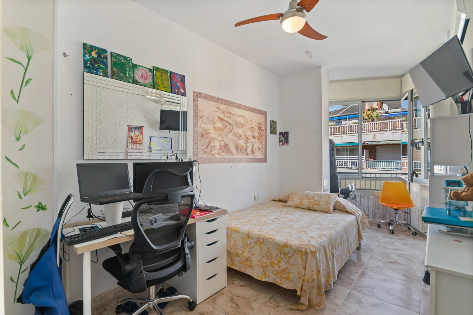 Bedroom with a bed and desk beside the window